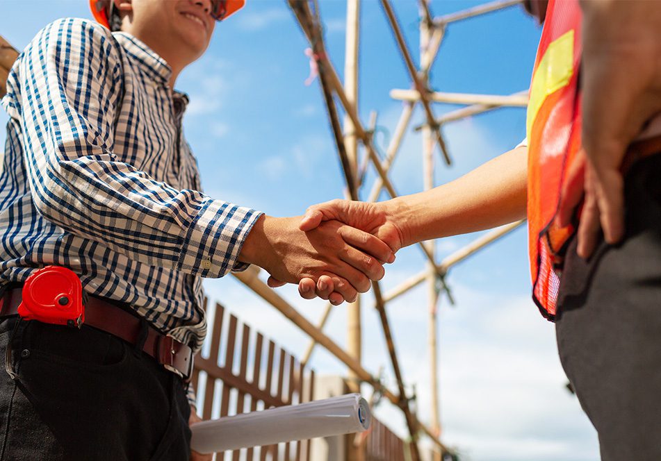 Engineer contractor shaking hands.