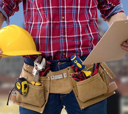 closeup of the worker of the construction with the helmet and the folder of the documents
