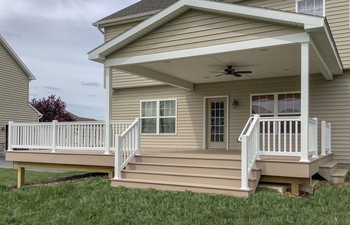 A beautiful house with white vinyl deck railings