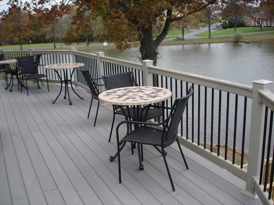 outdoor seating area beside a vinyl railing