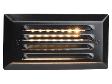 The Pyxis LED recessed light for stairs with light shining out of the slats.